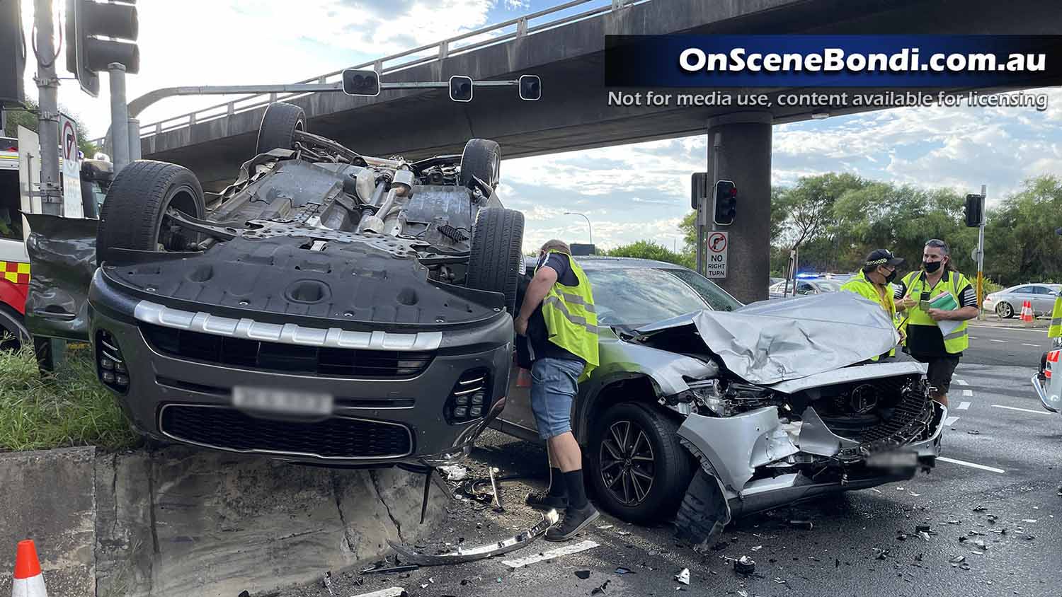 Family escape overturned car after crash in Botany