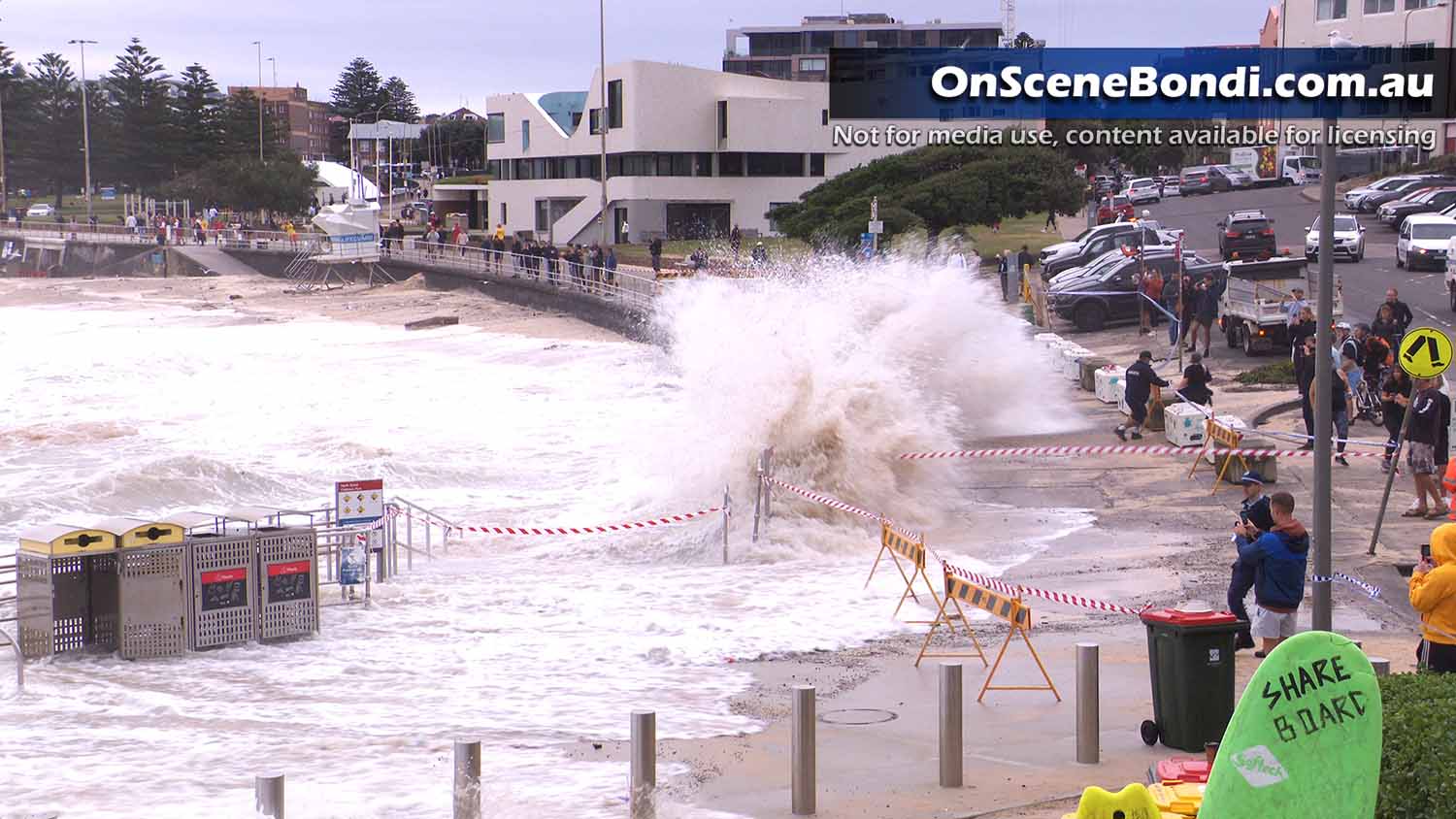 Huge waves impact Bondi Beach sending the sea onto the road